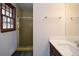 Bathroom featuring a vanity with modern fixtures and a glass-enclosed shower at 4800 Timber Ridge Dr, Douglasville, GA 30135