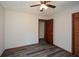 A cozy bedroom with hardwood floors, bi-fold closet and simple wall décor at 4800 Timber Ridge Dr, Douglasville, GA 30135
