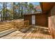 Wooden deck features wood railing overlooking private backyard surrounded by tall trees at 4800 Timber Ridge Dr, Douglasville, GA 30135