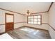 Dining room with wood-look floors, neutral paint, and natural light at 4800 Timber Ridge Dr, Douglasville, GA 30135