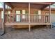 Inviting front porch with wood railing and trim at 4800 Timber Ridge Dr, Douglasville, GA 30135