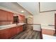 Kitchen featuring stainless steel appliances, countertops and wood-look floors at 4800 Timber Ridge Dr, Douglasville, GA 30135