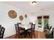 Dining area with hardwood floors, decorative wall art, and a door to the exterior at 6038 Mayfield Se Way, Mableton, GA 30126