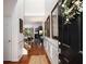 Inviting foyer with hardwood floors, wainscoting, and a view into the living space at 6038 Mayfield Se Way, Mableton, GA 30126