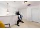 Hallway with Peloton exercise bike, overhead light fixture and white doors at 6038 Mayfield Se Way, Mableton, GA 30126