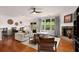 Spacious living room with a fireplace, hardwood floors, and ample natural light at 6038 Mayfield Se Way, Mableton, GA 30126