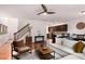 Comfortable living room showcasing hardwood floors, staircase, and an open layout to the kitchen at 6038 Mayfield Se Way, Mableton, GA 30126