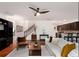Bright and airy living room with hardwood floors, ceiling fan, and open layout to the kitchen at 6038 Mayfield Se Way, Mableton, GA 30126