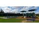 Community playground with covered picnic tables and play structure at 6038 Mayfield Se Way, Mableton, GA 30126