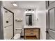 This bathroom features a glass enclosed shower and modern fixtures at 10020 Normandy Ln, Suwanee, GA 30024