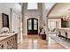Welcoming foyer with hardwood floors, high ceilings, and views into the formal dining room at 10020 Normandy Ln, Suwanee, GA 30024