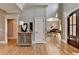 Bright foyer with hardwood floors that leads into the formal living room with elegant accents at 10020 Normandy Ln, Suwanee, GA 30024