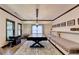 Large game room featuring a game table and adjacent seating at 10020 Normandy Ln, Suwanee, GA 30024