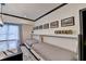 Game room with murphy beds, game table, and natural light at 10020 Normandy Ln, Suwanee, GA 30024