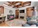 Living room boasting coffered ceilings, fireplace, and built-in cabinets at 10020 Normandy Ln, Suwanee, GA 30024