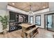 Spacious wine cellar offers ample storage, a rustic tasting table, and patio access at 10020 Normandy Ln, Suwanee, GA 30024