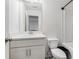 Bathroom with white cabinets, sink, toilet, bathtub and shower combo at 160 Auburn Gate Ln, Auburn, GA 30011