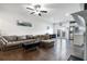 Well-lit living room featuring hardwood floors, neutral tones, and modern furniture at 160 Auburn Gate Ln, Auburn, GA 30011