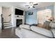 Spacious living area featuring hardwood floors, a fireplace, and open access to the kitchen at 160 Auburn Gate Ln, Auburn, GA 30011
