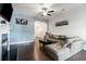 Bright living room with a cozy fireplace, hardwood floors, and a comfortable sectional at 160 Auburn Gate Ln, Auburn, GA 30011