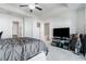 Bright main bedroom featuring a tray ceiling, ample natural light, and neutral decor at 160 Auburn Gate Ln, Auburn, GA 30011