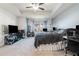 Spacious main bedroom with a tray ceiling, a large window, and carpeted floor at 160 Auburn Gate Ln, Auburn, GA 30011
