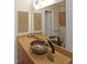 Stylish bathroom featuring a stone vessel sink, modern faucet, and decorative wall art at 3907 Cedar Cir, Tucker, GA 30084