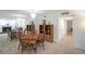 Open dining area features hardwood table set, display shelving, and reflective mirrored wall at 3907 Cedar Cir, Tucker, GA 30084