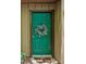 Inviting entry with a green door and wreath, creating a warm welcome to the property at 3907 Cedar Cir, Tucker, GA 30084