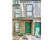 View of townhouse front entrance with turquoise-colored front doors at 3907 Cedar Cir, Tucker, GA 30084