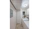 Functional laundry room with washer, dryer, storage cabinets, and access to utility area at 3907 Cedar Cir, Tucker, GA 30084