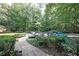 View of complex parking lot surrounded by greenery at 3907 Cedar Cir, Tucker, GA 30084
