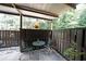 Relaxing patio with outdoor seating, decorative plants, and a serene view of the surrounding greenery at 3907 Cedar Cir, Tucker, GA 30084