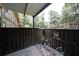 Inviting patio with privacy fencing, greenery, and stone accents for outdoor relaxation at 3907 Cedar Cir, Tucker, GA 30084