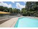 Bright community pool and tennis courts in background, providing diverse recreational opportunities at 3907 Cedar Cir, Tucker, GA 30084