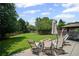 The beautiful backyard has plenty of space for activities with an outdoor fireplace and gazebo at 5010 Amber Leaf Dr, Roswell, GA 30076