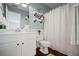 Bathroom featuring a white vanity, toilet, and a shower with a curtain at 5010 Amber Leaf Dr, Roswell, GA 30076