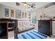 The bedroom has comic themed decor, a futon, and a chest of drawers at 5010 Amber Leaf Dr, Roswell, GA 30076