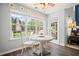 Cozy breakfast nook with abundant natural light and a view of the backyard and patio at 5010 Amber Leaf Dr, Roswell, GA 30076