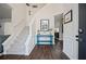 Bright foyer with staircase, hardwood floors, and stylish decor at 5010 Amber Leaf Dr, Roswell, GA 30076
