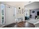 Inviting foyer featuring hardwood floors, natural light and a bench with storage at 5010 Amber Leaf Dr, Roswell, GA 30076