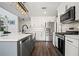 Modern kitchen featuring stainless steel appliances, custom cabinets, and a center island at 5010 Amber Leaf Dr, Roswell, GA 30076