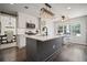 Modern kitchen with stainless steel appliances and an island with an eat-in breakfast bar at 5010 Amber Leaf Dr, Roswell, GA 30076