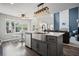 Kitchen with stainless steel appliances and an island with an eat-in breakfast bar at 5010 Amber Leaf Dr, Roswell, GA 30076