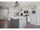 Modern kitchen with stainless steel appliances, central island, and stylish light fixtures at 5010 Amber Leaf Dr, Roswell, GA 30076