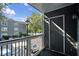 Exterior of balcony with dark gray walls and metal rails looking towards apartment complex at 5207 Santa Fe Pkwy, Sandy Springs, GA 30350