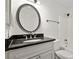 Clean bathroom featuring a granite vanity and shower-tub combo at 5207 Santa Fe Pkwy, Sandy Springs, GA 30350