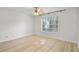 Bedroom with ceiling fan, light wood flooring, and natural light at 5207 Santa Fe Pkwy, Sandy Springs, GA 30350