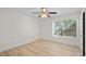 Bedroom with light wood flooring, ceiling fan and a bright window at 5207 Santa Fe Pkwy, Sandy Springs, GA 30350