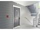Apartment entryway featuring a gray door with unit number and nearby stairs at 5207 Santa Fe Pkwy, Sandy Springs, GA 30350